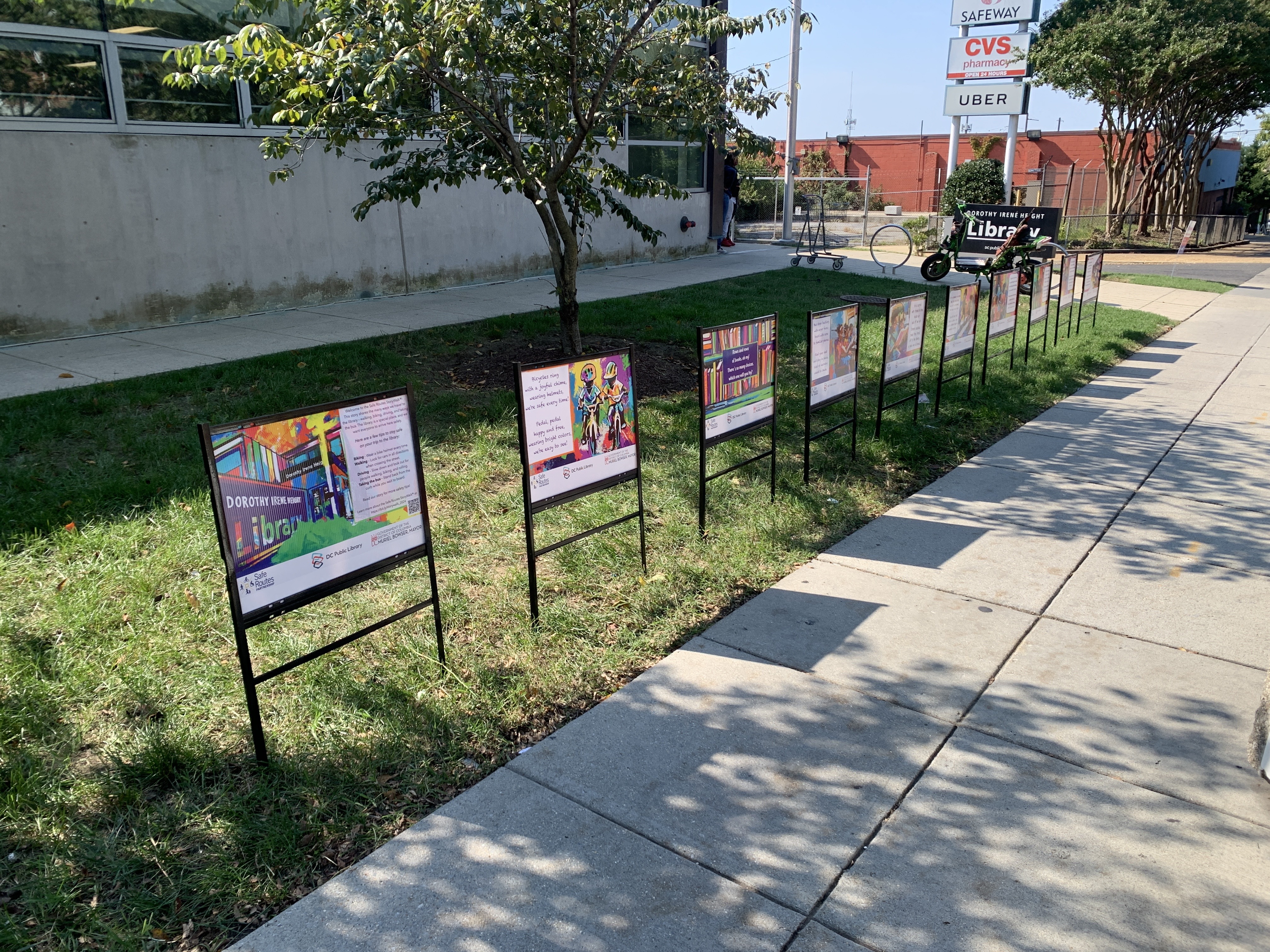 StoryWalk pages displayed in front of Benning Library in Washington, DC