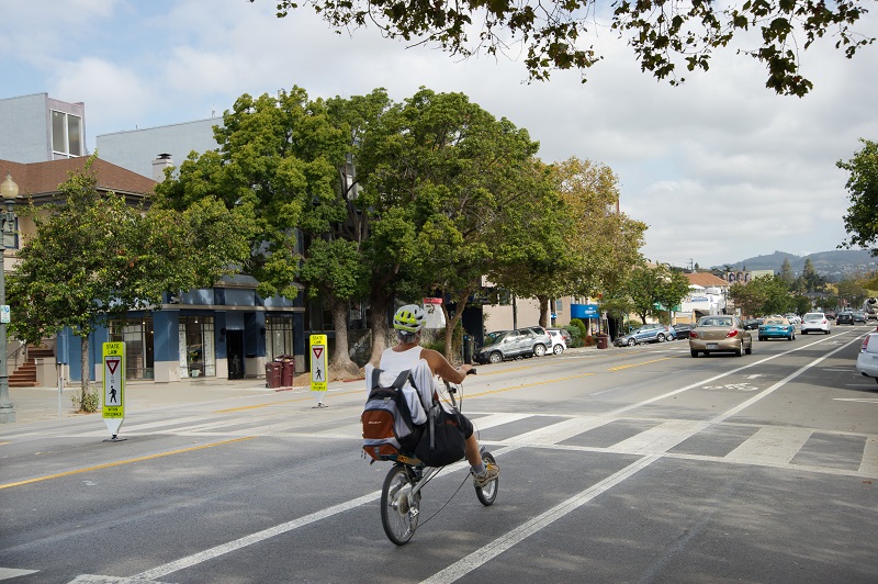 street with bike lane recumbent bike and crosswalk